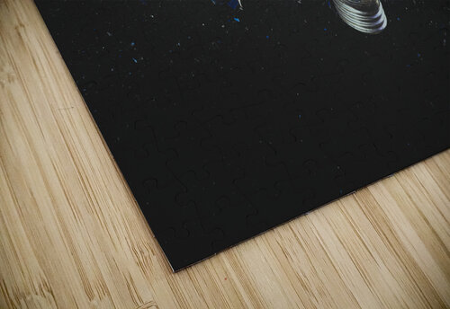 blue light bulb exploding on black.  Gualtiero Boffi puzzle