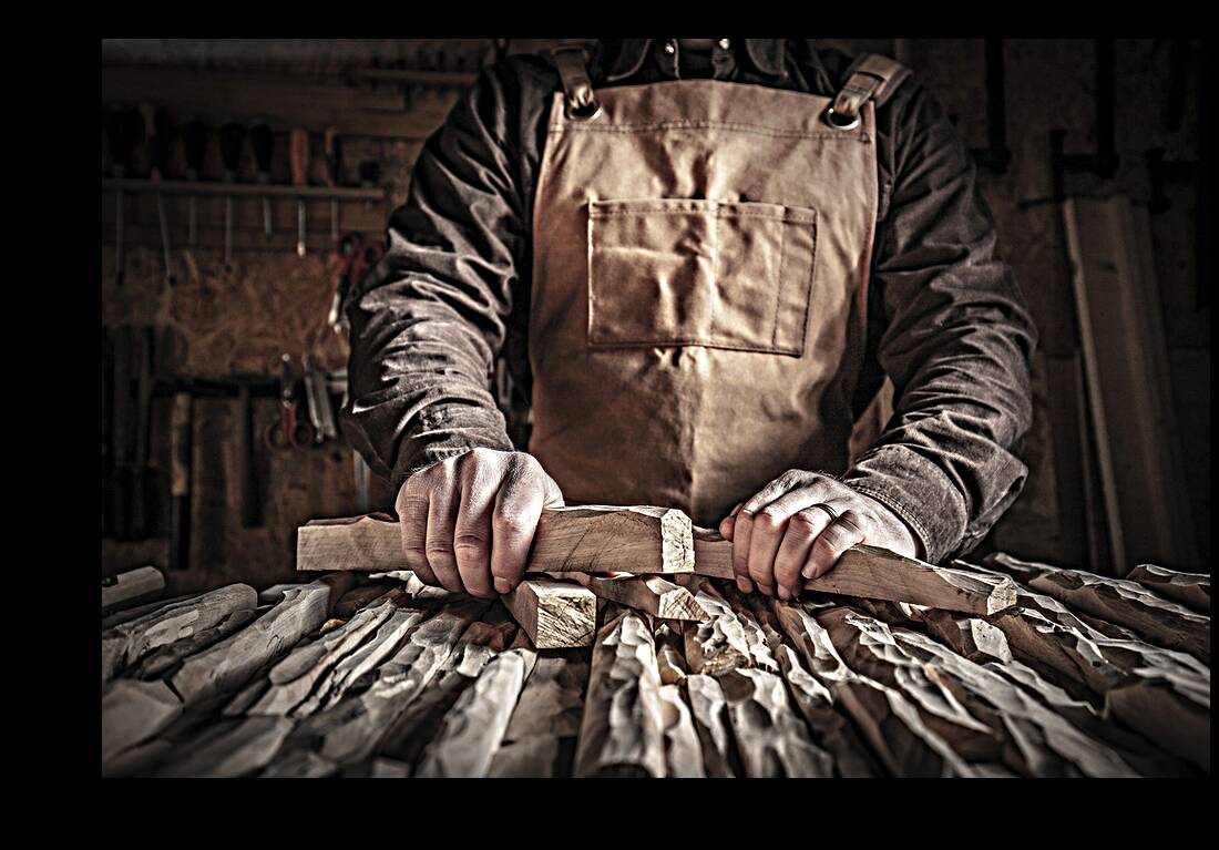 carved wood in hands Reproduction