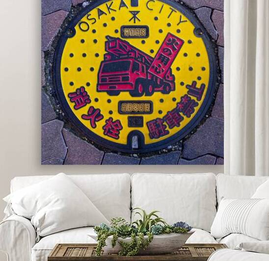 manhole cover with fire truck in Osaka by Gualtiero Boffi