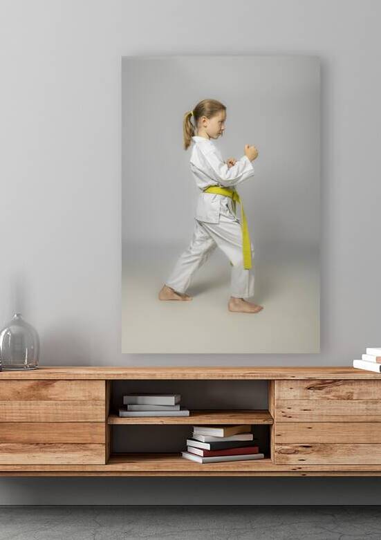 child practises martial arts by Gualtiero Boffi