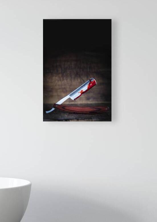 traditional razor covered in blood  by Gualtiero Boffi