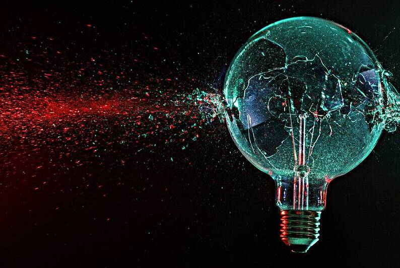 large green bulb exploding on a black  by Gualtiero Boffi