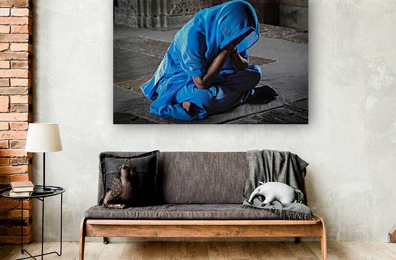 Indian woman prays by Gualtiero Boffi
