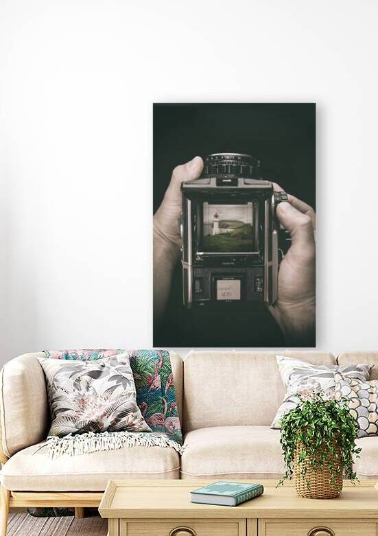 hands hold a medium format film camera dark background by Gualtiero Boffi