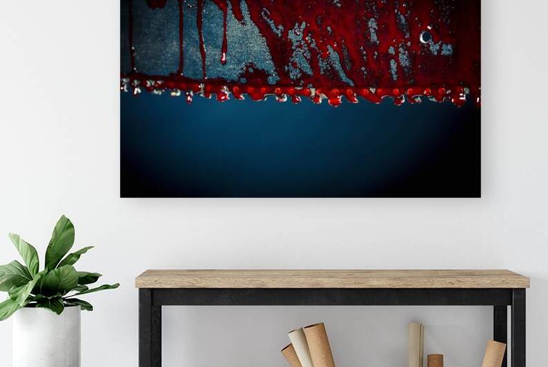 chainsaw stained with blood  by Gualtiero Boffi