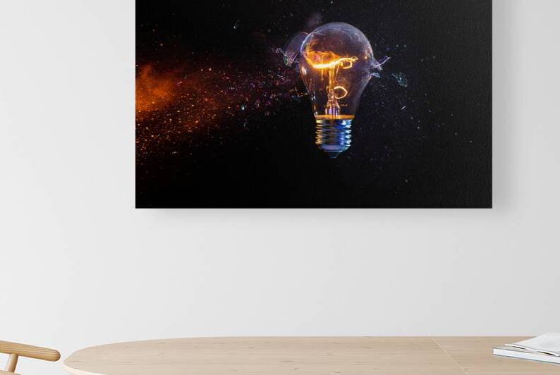 Struck electric bulb breaks into fragments tungsten filament li by Gualtiero Boffi