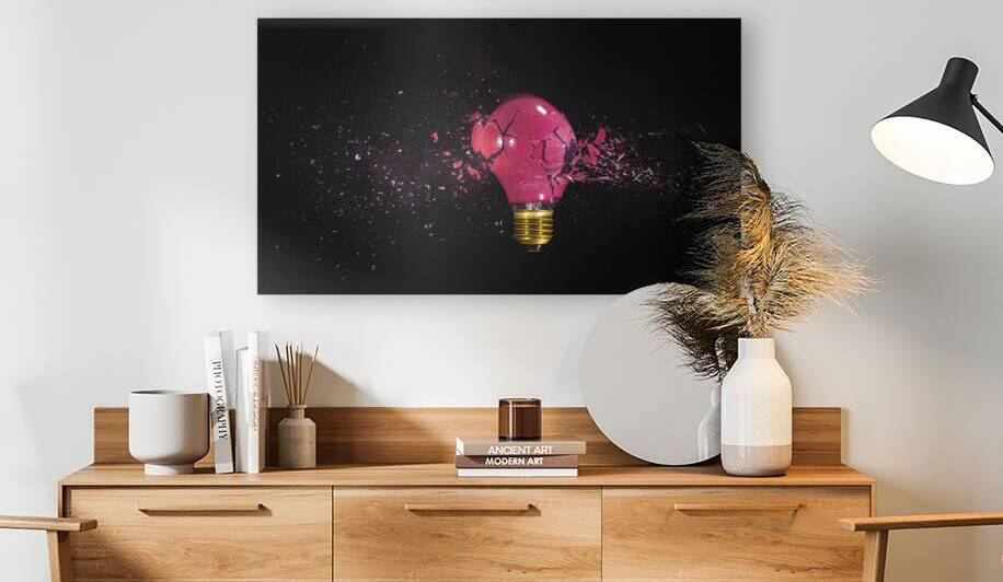 breaking of a red bulb on a black background.  by Gualtiero Boffi