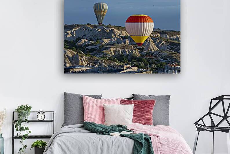 hot air balloons fly over the city of goreme by Gualtiero Boffi