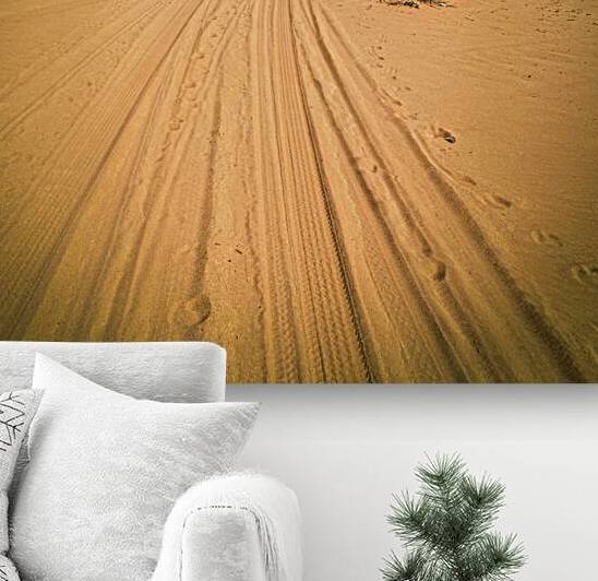 tire tracks on the sand of the wadi rum desert. by Gualtiero Boffi