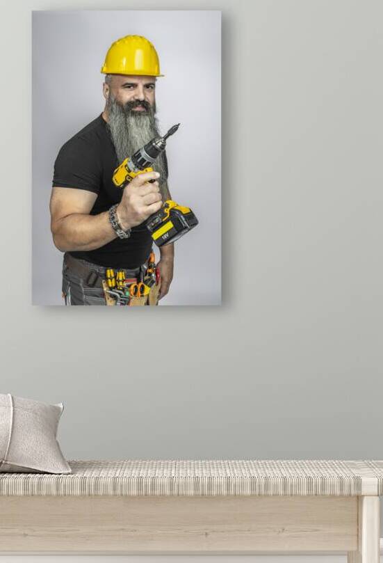 handyman with electric screwdriver by Gualtiero Boffi
