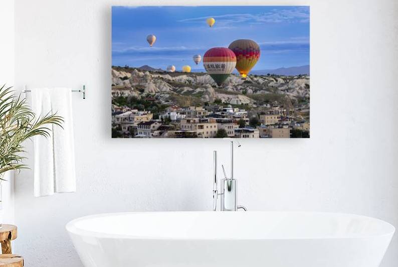 hot air balloon flies over the city of goreme  by Gualtiero Boffi