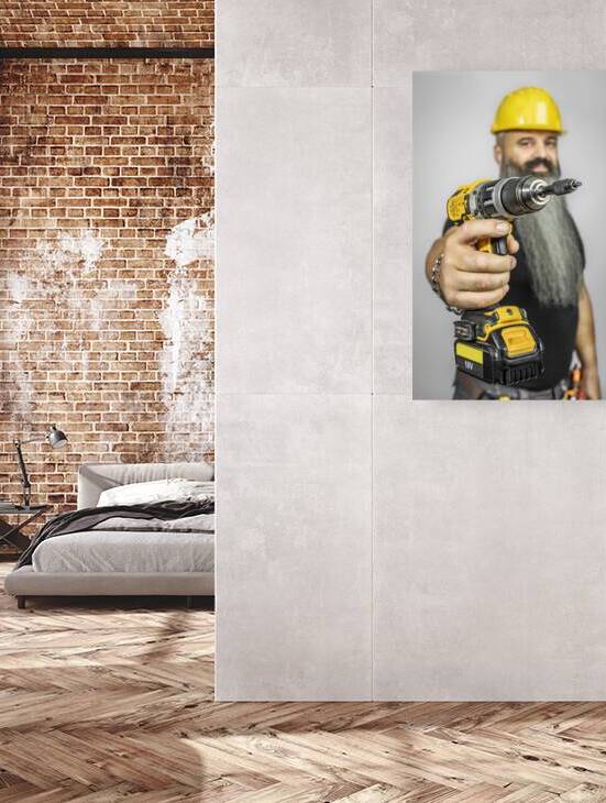 worker with electric screwdriver by Gualtiero Boffi