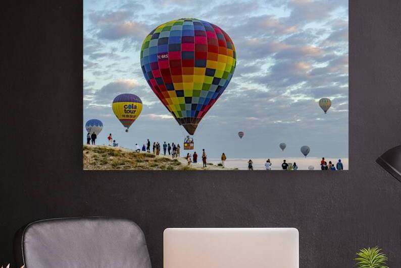 hot air balloons fly over the skies of cappadocia at dawn by Gualtiero Boffi