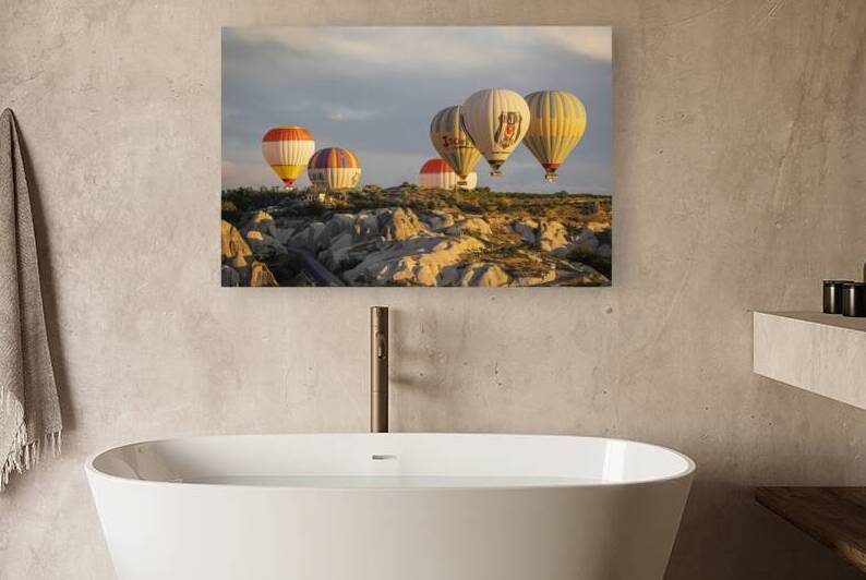 hot air balloons flying over the hills of goreme. by Gualtiero Boffi