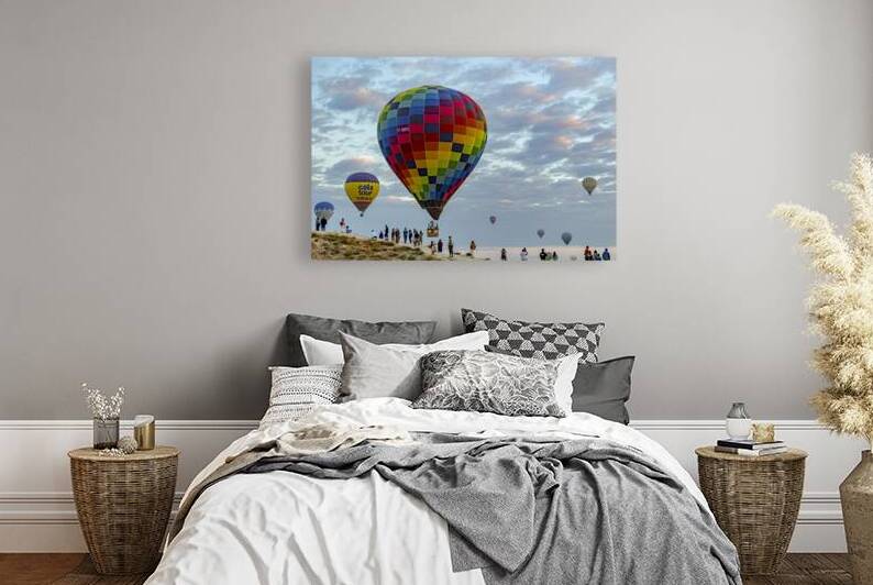 ot air balloon flies low over the city of goreme  by Gualtiero Boffi