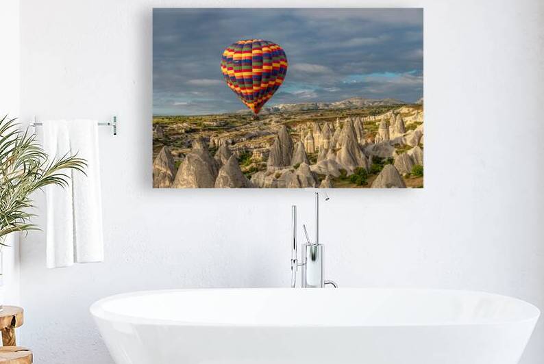 colorful hot air balloon flying over the goreme valley by Gualtiero Boffi