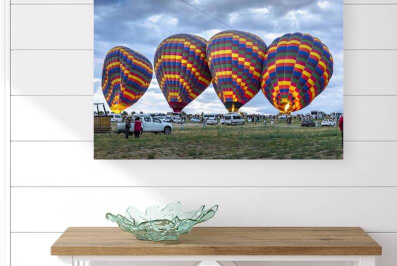 hot air balloons are being prepared for the morning flight by Gualtiero Boffi
