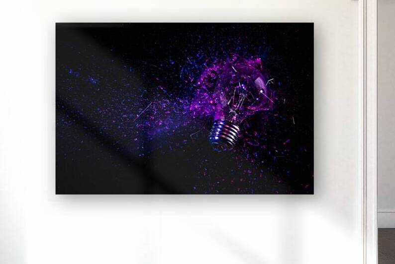 explosion of an electric light bulb on black.  by Gualtiero Boffi