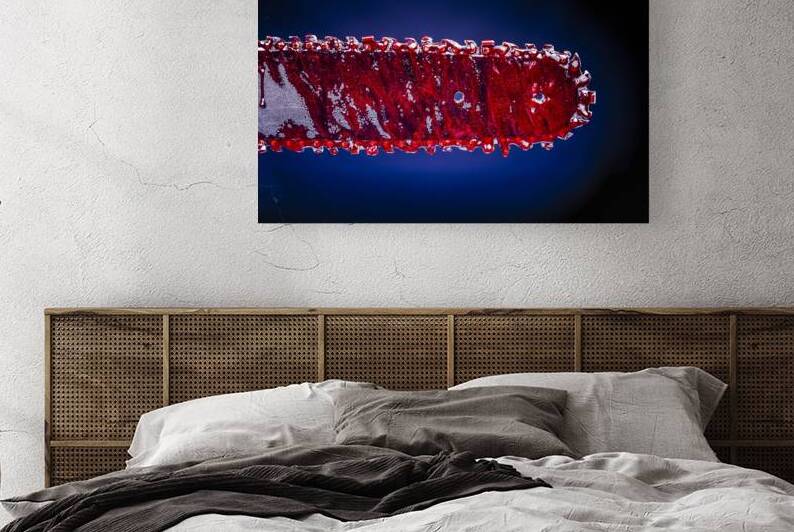 detail of a chain saw covered in blood.  by Gualtiero Boffi
