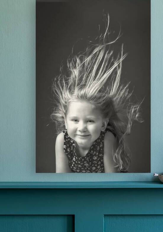girl with her hair raised in the air by the wind. by Gualtiero Boffi