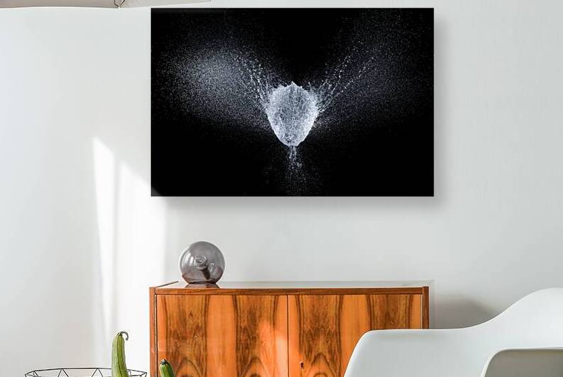 balloon explosion filled with water at the exact moment of the e by Gualtiero Boffi