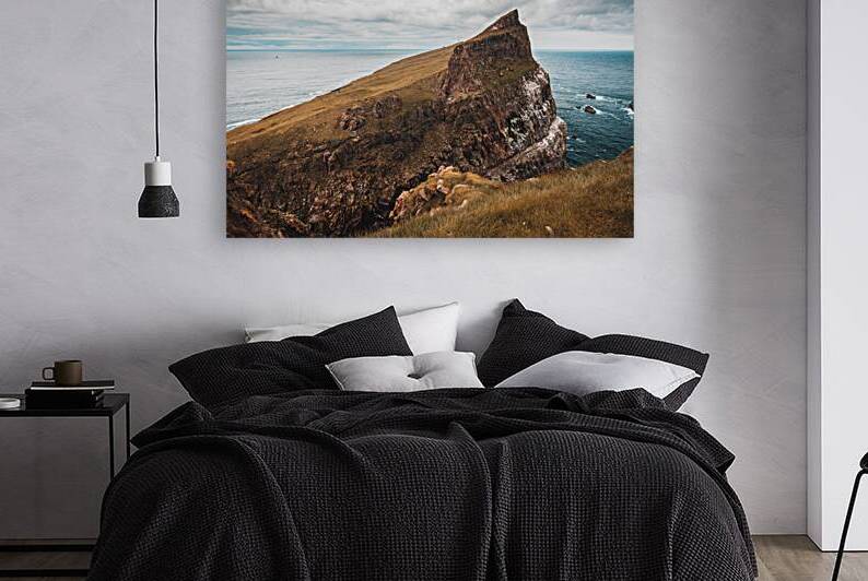 cliffs and the village on the island of Mykines Faroe. by Gualtiero Boffi