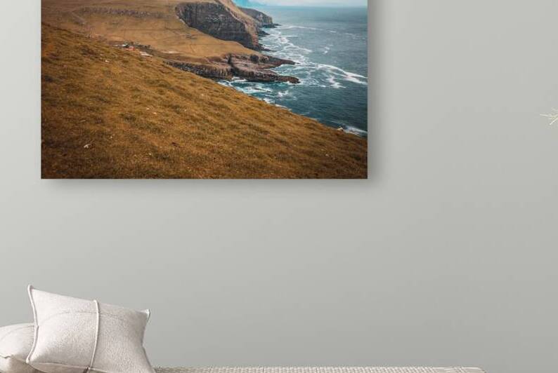  cliffs and the village on the island of Mykines Faroe. by Gualtiero Boffi