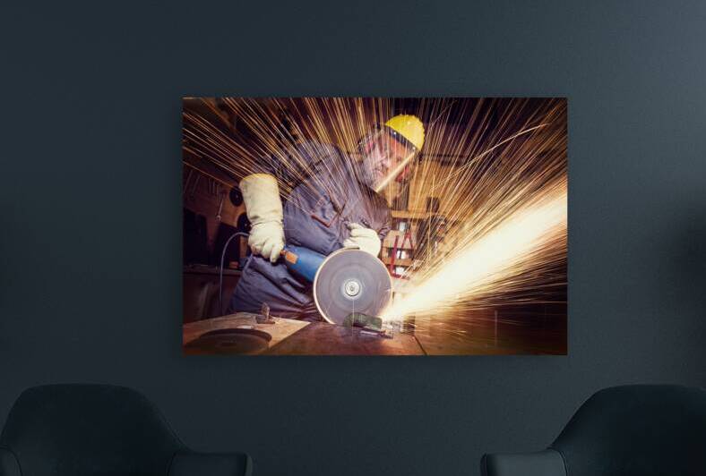 man with grinder in action by Gualtiero Boffi