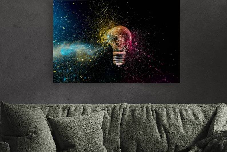Lightbulb exploding with colorful powder by Gualtiero Boffi