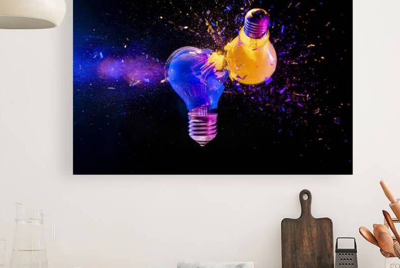 Two colorful light bulbs exploding in a cloud of shards by Gualtiero Boffi