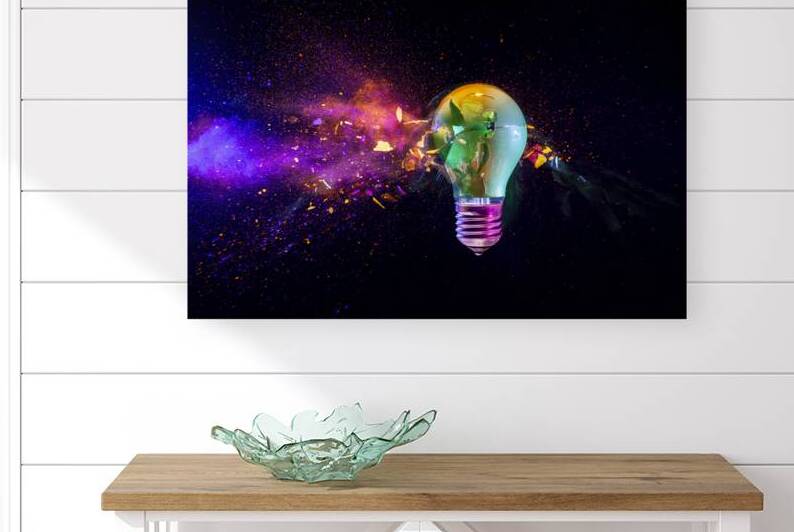 Broken light bulb exploding with colorful  by Gualtiero Boffi