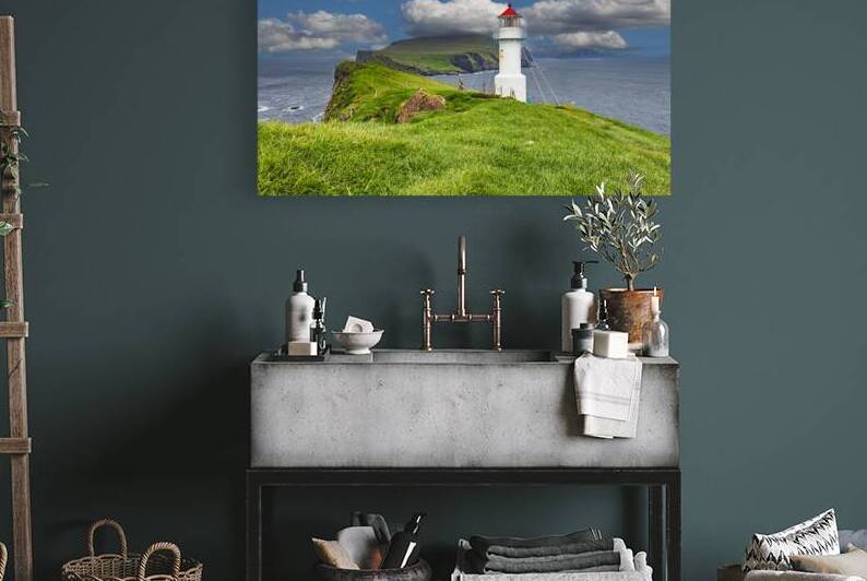 White lighthouse standing on green grass field  by Gualtiero Boffi