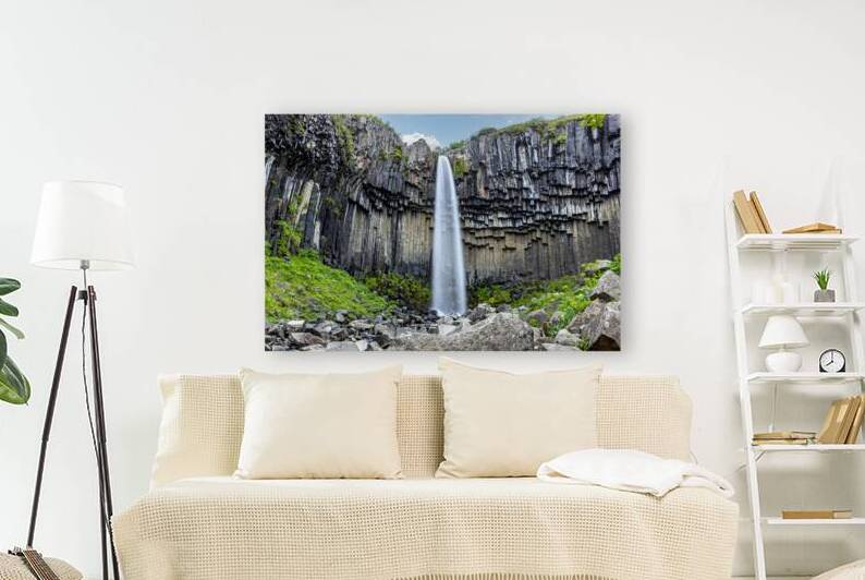 Powerful waterfall cascading over a dramatic cliff face in icela by Gualtiero Boffi