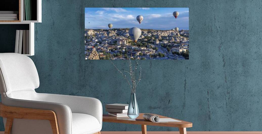 Hot air balloons flying over picturesque goreme town in cappadoc by Gualtiero Boffi