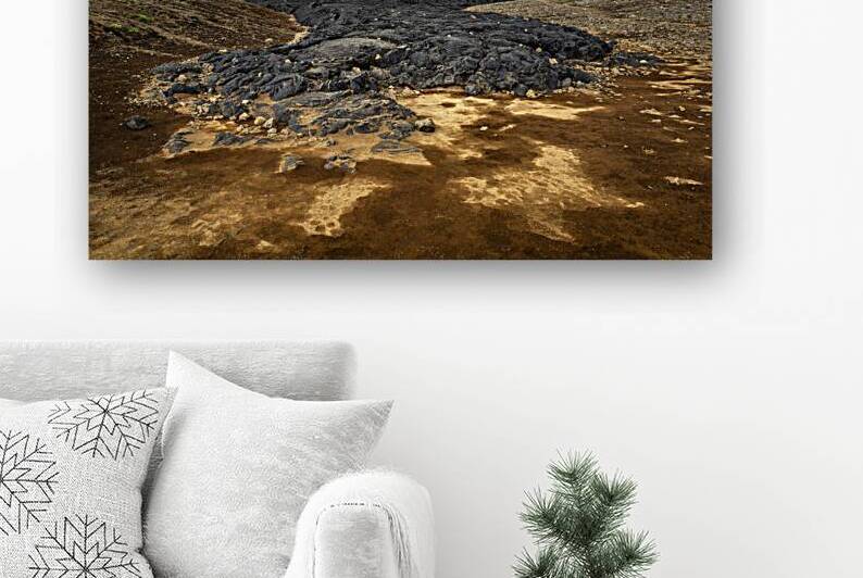 Black lava rocks flowing through a mountain valley in iceland by Gualtiero Boffi