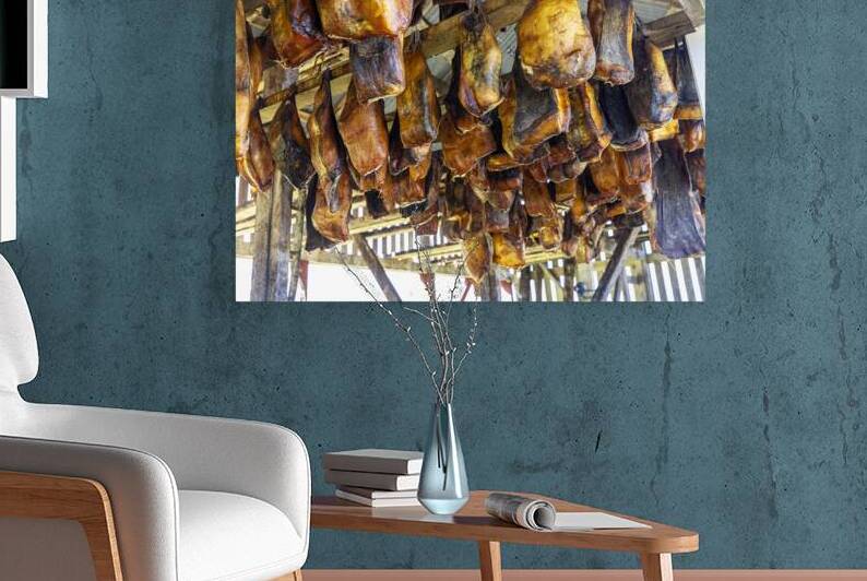 fish drying in a wooden hut by Gualtiero Boffi