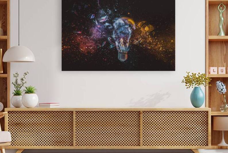 Broken light bulb releasing colorful explosion of energy by Gualtiero Boffi