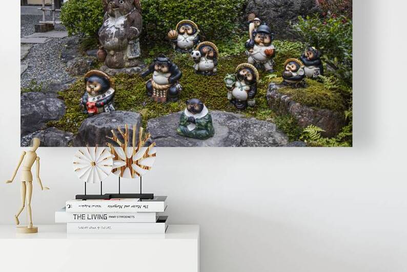 Tanuki statues displaying traditional japanese culture in a gard by Gualtiero Boffi