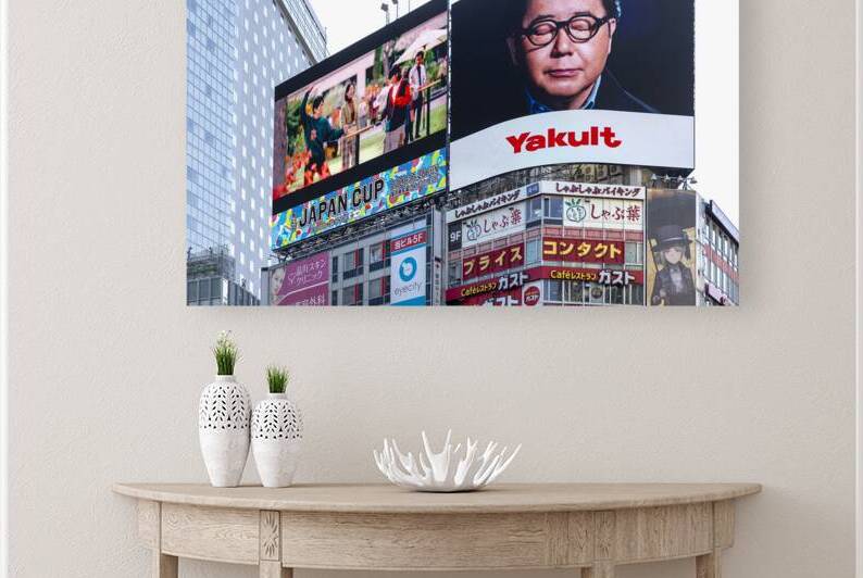 Large electronic billboards showing advertisements in shinjuku  by Gualtiero Boffi