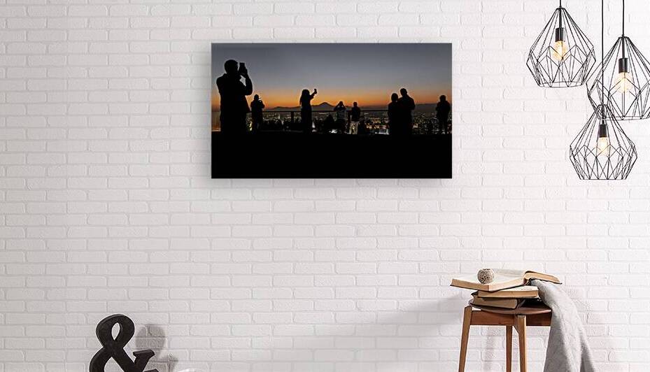 Tourists taking pictures of mount fuji at sunset from tokyo roof by Gualtiero Boffi