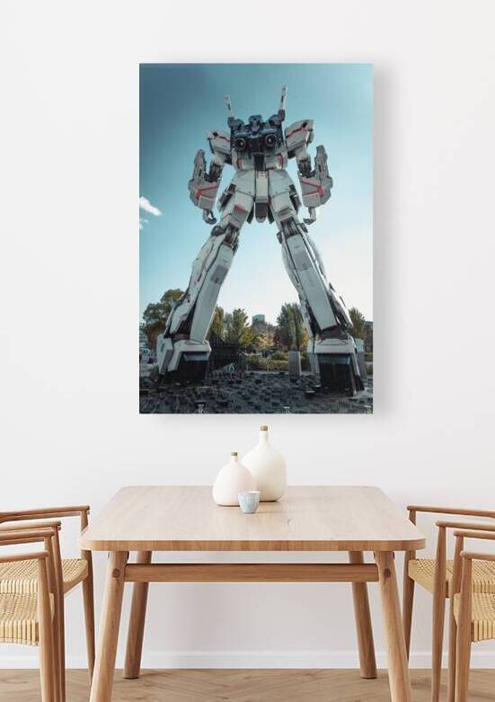 Imposing gundam statue standing tall against a clear blue sky by Gualtiero Boffi
