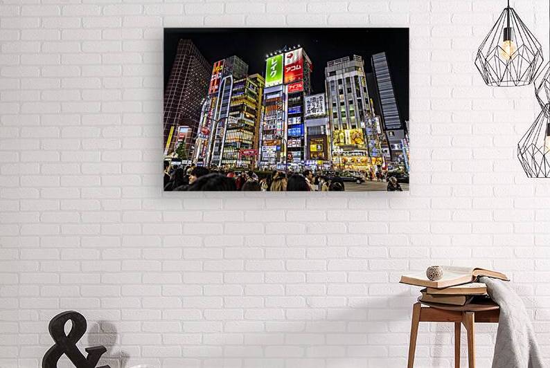 Tourists and locals crossing the street in shinjuku by Gualtiero Boffi