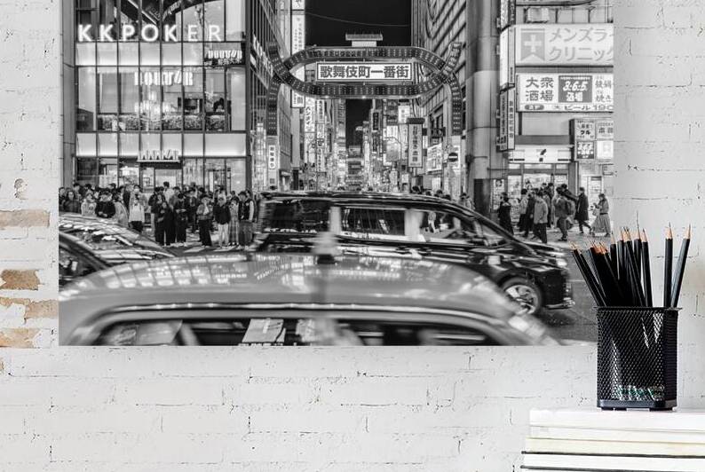 Tourists crossing busy street at night in tokyo japan by Gualtiero Boffi
