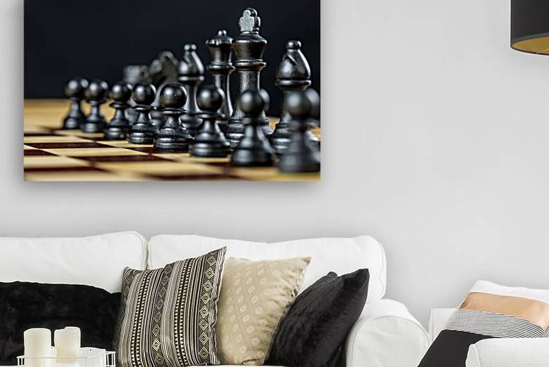 Chess pieces standing on chessboard by Gualtiero Boffi