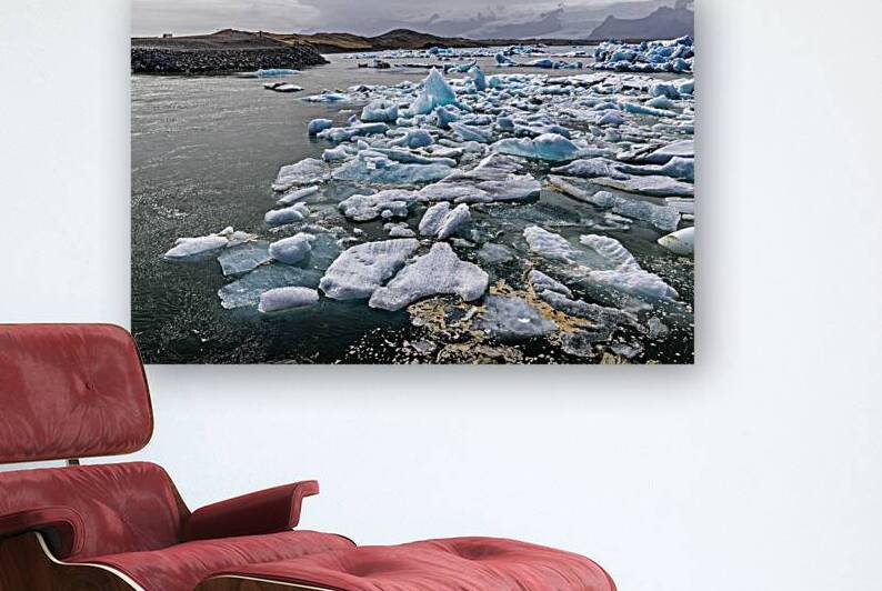 Icebergs floating in jokulsarlon glacier lagoon in iceland under by Gualtiero Boffi