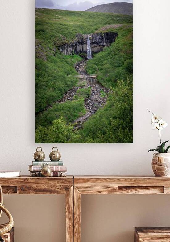 Scenic view of a waterfall flowing over basalt columns by Gualtiero Boffi