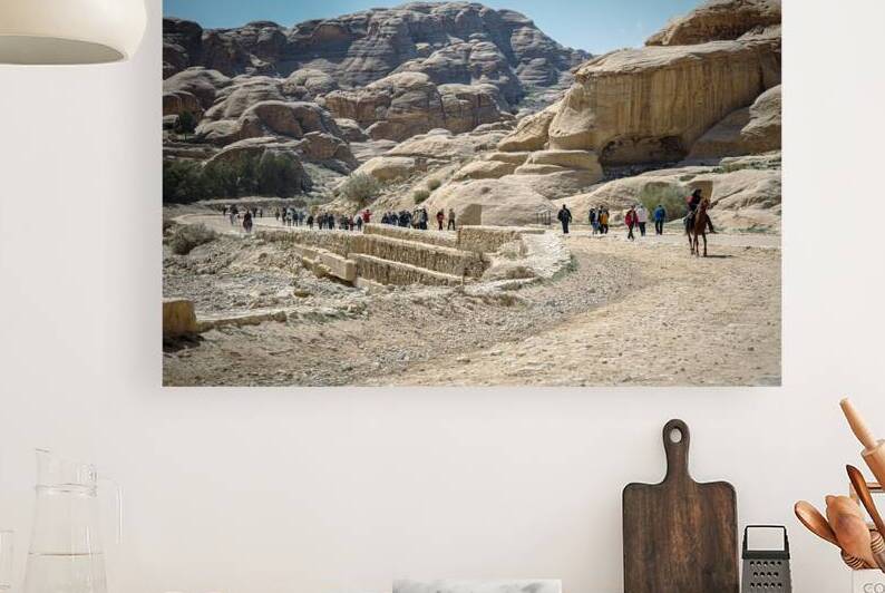 Tourists walking and riding horse in petra by Gualtiero Boffi