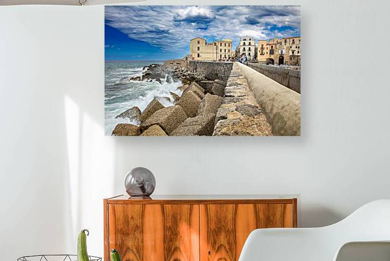 Sea waves crashing against the fortified walls of cefalu touris by Gualtiero Boffi
