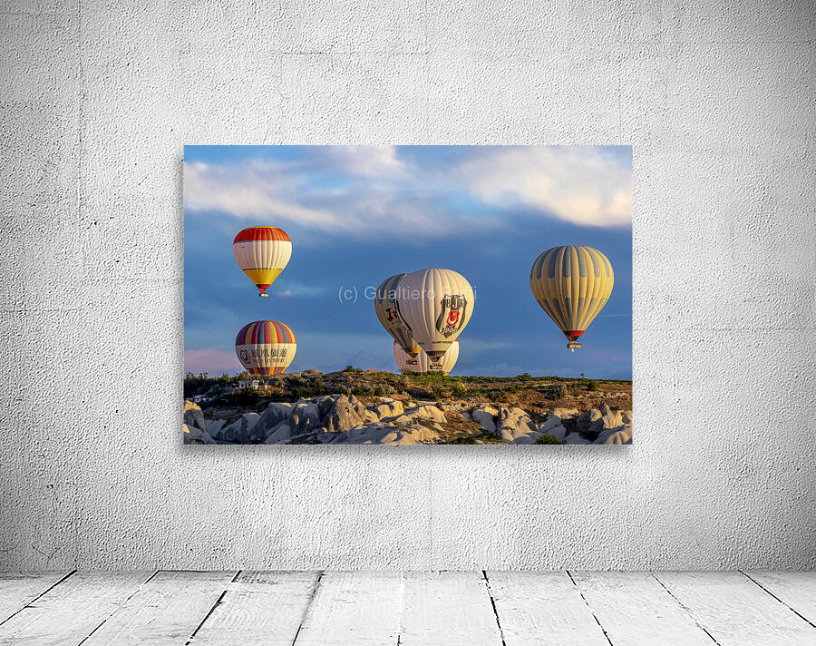 Hot air balloons fly over Goreme. Turkey Wall Preview