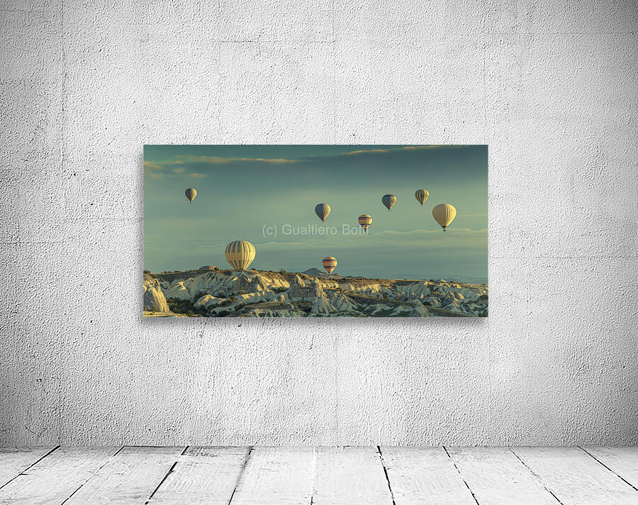 hot air balloons fly over goreme at dawn. Wall Preview